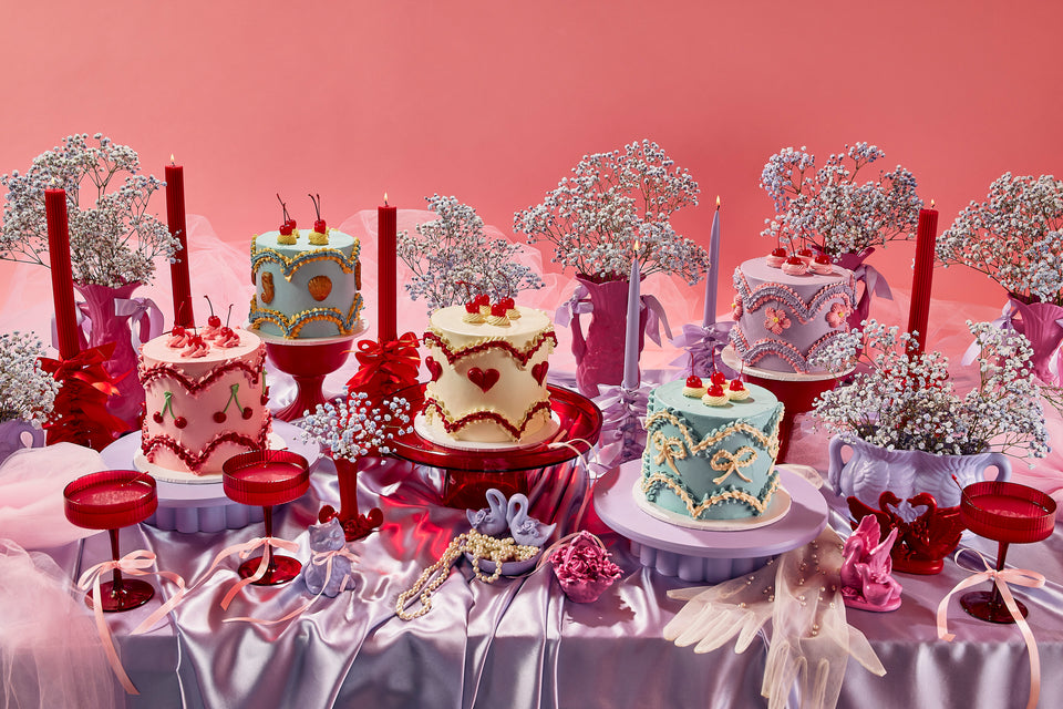 Fancy cakes styled on a gorgeous lilac tablescape